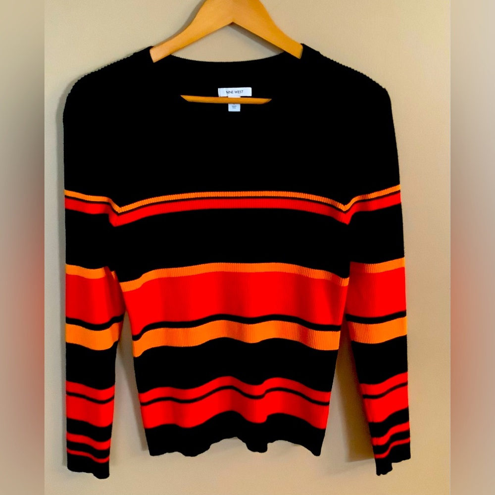9 west sweater RN#73277 size L black background with orange and peach stripes